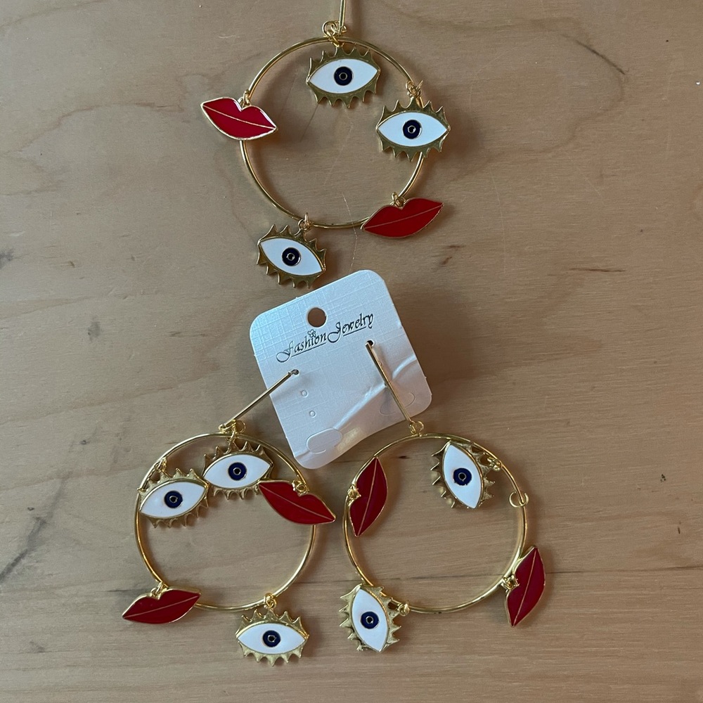 Gold eye and lip earrings